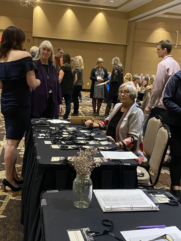 Registration table with name badges and lanyards as guests arrive for the MVAN Women in Business Awards luncheon
